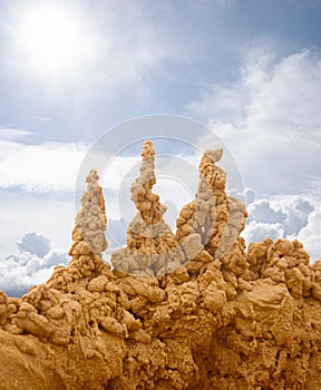 Sand castles on sky background