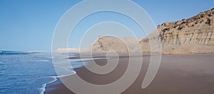 Sand cliffs of Dakhla in Western Sahara region of Morocco, with sea photo