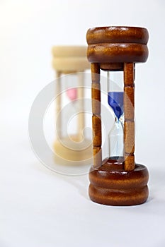 Sand Clock representing man in front of woman photo