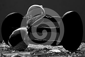 Sand clock on broken glass pieces in blur.