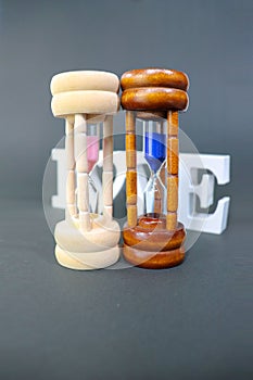 Sand clock. Parallel worlds exist at the same time in each couple photo