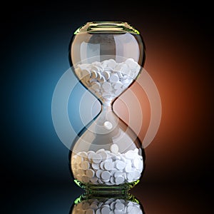 Sand Clock With Pills In Black Studio With Artistic Backlight photo