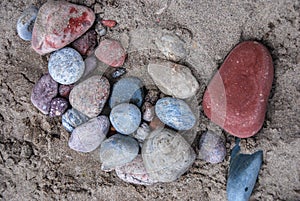 Sand cover pile of pretty collored rocks