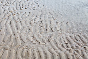 Sand curve texture on the beach