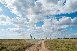 Sand dirt road path way field meadow landscape blue sky clouds