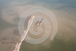 Sand dredger on barge