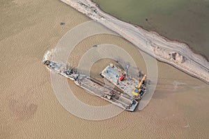 Sand dredger on barge