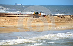 Sand dredger on beach