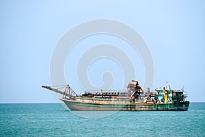 Sand drifting boats floating on horizo line in sea