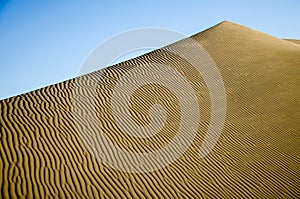 A sand dune close to the oasis Huacachina, near Ica, Peru photo