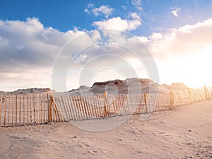 Sand dune of Dog`s bay beach at sunset. Clear blue cloudy sky. Calm and peaceful mood. County Galway, Ireland. Tourist gem of
