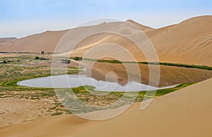 Badain Jaran Desert with lake and reflection