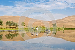 Badain Jaran Desert with lake and reflection