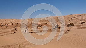 Sand dunes around a valley in the Sahara Desert
