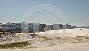 Sand dunes and beachfront buildings at Forte beach. Cabo Frio, Rio de Janeiro, Brazil
