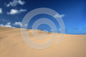 Sand dunes and blue skies