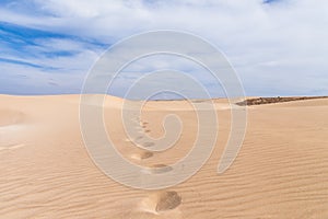 Sand dunes in Boavista desert with blue sky and clouds, Cape Verde - Cabo Verde