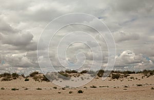 Sand dunes and cloudy sky