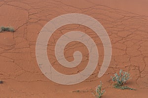 Sand dunes cracking creating patterns and ripples and textures on the hill after a storm in the United Arab Emirates