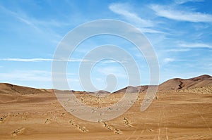 Sand dunes of the desert under blue sky - extreme heat