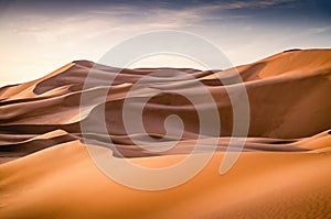 Sand dunes of Erg Chebbi. Vast desert landscape with high dunes during sunset