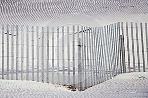 Sand dunes and fence abstract pattern