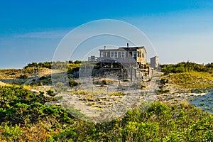 Sand Dunes, house and Grass of the Provincelands Cape Cod MA US.