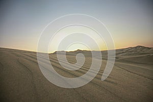 Sand dunes of Ica in Peru just before sunset