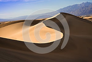 Sand dunes landscape seen at Death Valley National Park, California at sunset