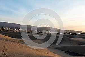 Sand dunes of Maspalomas with a view of the city on Gran Canaria, Spain