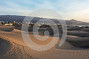 Sand dunes of Maspalomas with a view of the city on Gran Canaria, Spain