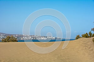 Sand dunes of Maspalomas with a view of the city on Gran Canaria, Spain