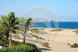 Sand dunes of Maspalomas with a view of the city on Gran Canaria, Spain