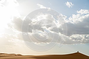 Sand dunes in Morocco. Erg Chebbi Sahara desert. Yellow red sand and blue sky