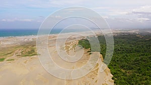 Sand dunes near the ocean, aerial view.