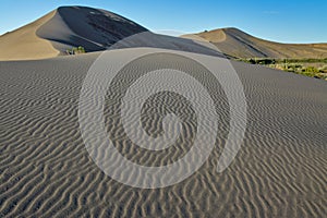 Sand dunes and ripples with a blue sky