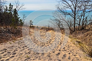 Sand dunes with traces of people on a sand path down. Indiana Dunes National Lakeshore, USA