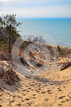 Sand dunes with traces of people on a sand path down. Indiana Dunes National Lakeshore, USA