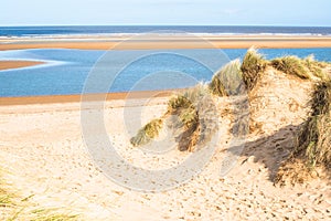 Sand dunes where Norfolk Coast path National Trail from Barnham Overy Staithe reaches the sea