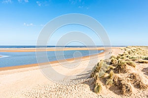 Sand dunes where Norfolk Coast path National Trail from Barnham Overy Staithe reaches the sea