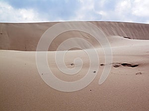 Sand dunes on windy day at Punto Paloma