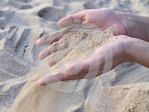 Sand falling from hands