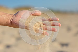 Sand falling from palm