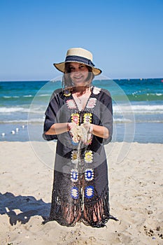 Sand falling from the woman`s hand.