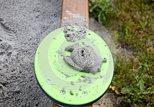 Sand fish and sand mold. Children's outdoor games in the sandbox.