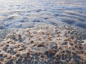 Sand and foam photo
