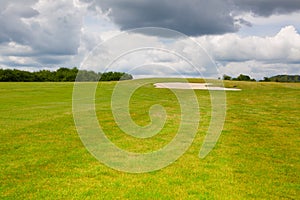 Sand golf bunker on a empty golf course before rain