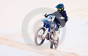 Sand, hill or athlete with motorbike for action, adventure or fitness with performance for adrenaline. Fast, speed or