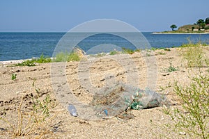 On the sand lies a tangled fishing net. The result of the activity of poachers.