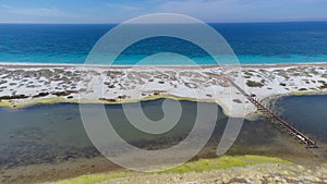 sand made up of small colored stones on the beach of Is Arutas in Sardinia, Italy photo